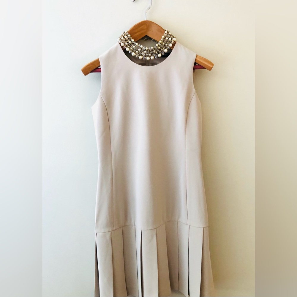 Sleeveless Beige Pleated-Hem Mini Dress